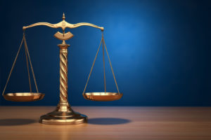 scales--300x200 37407677 - concept of justice. law scales on blue background. 3d