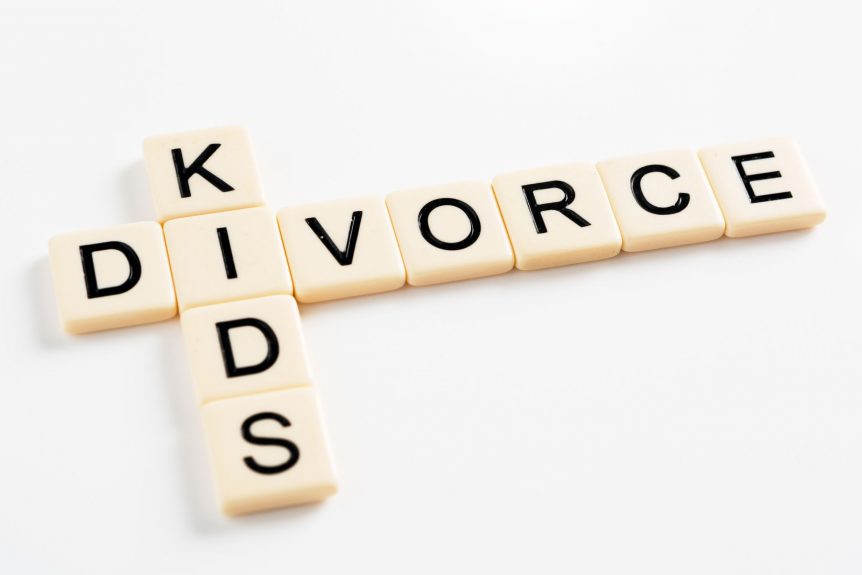 scrabble, kids and divorce spelled on crossword